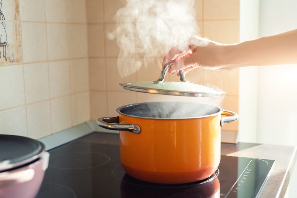 Best Lightwieght Cookware - Beautiful Ornage Pot of Boiling Water