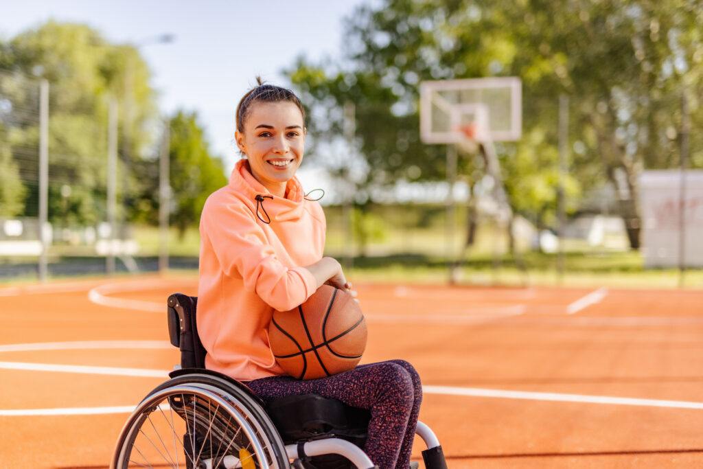 Keep Your Wheelchair Clean and tips on  how to keep your wheelchair clean - Woman in Wheelchair playing basketball 
