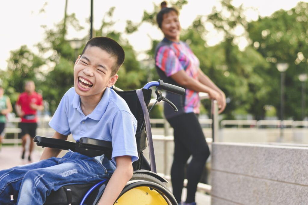 Active In A Wheelchir-Teenager Laughing In A Wheelchir