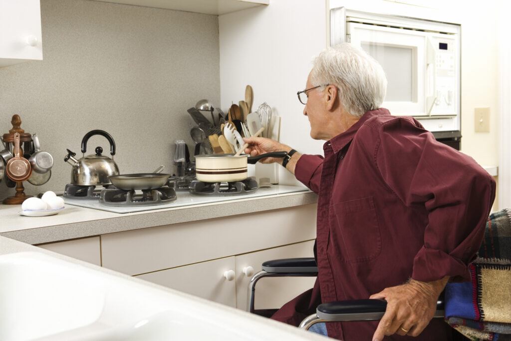 ADA Kitchen - Man In wheelchair cooking