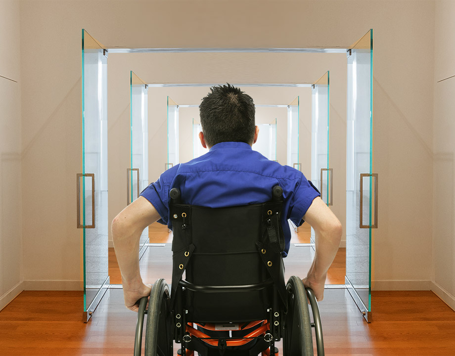  ADA Accessible Home - Man in wheelchair going though wide doors