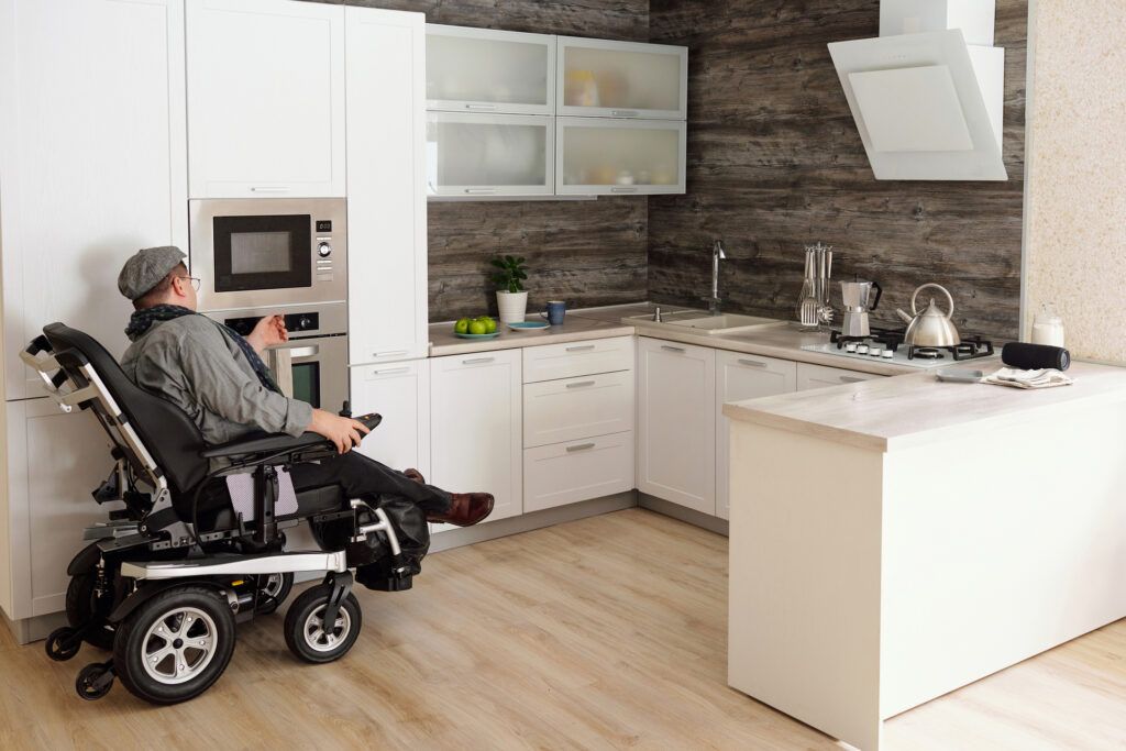 ADA Kitchen - man in wheelchair cooking