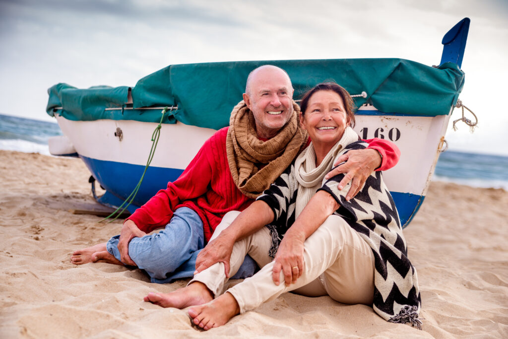 The 7 Best Boat Ladders For Elderly-senior coupe sitting on the beach