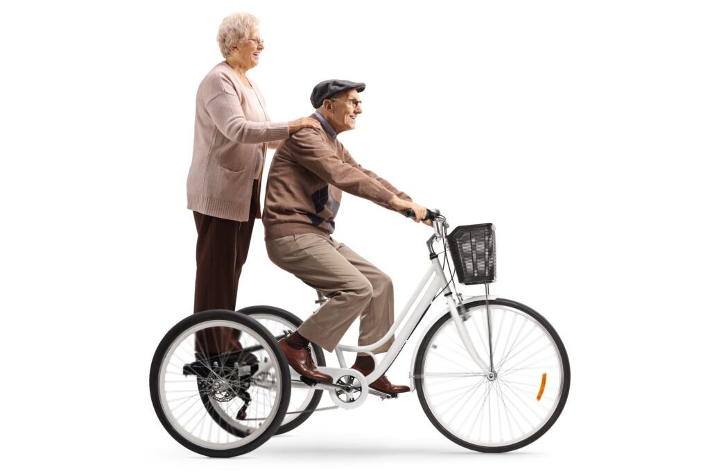 Senior man and woman riding a bike