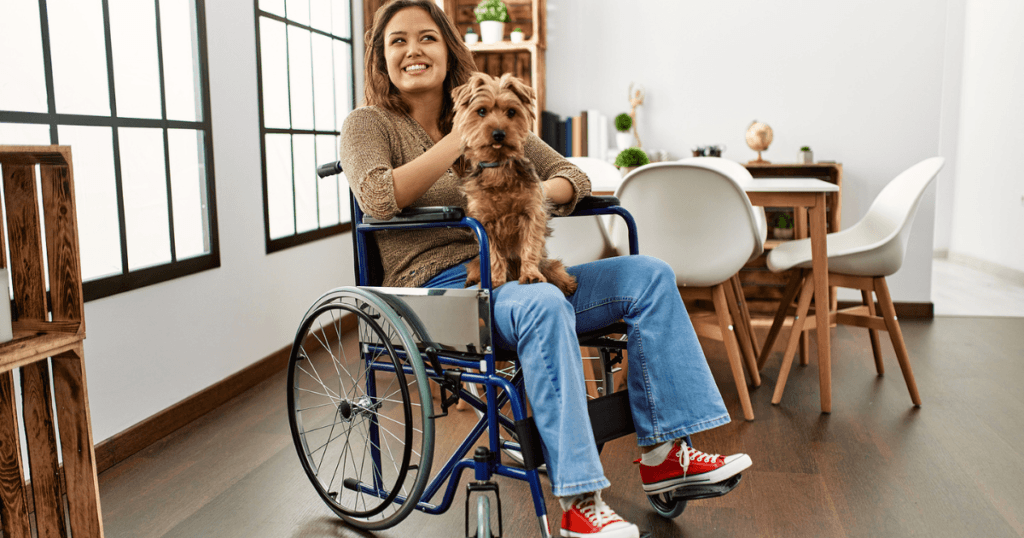 The Importance Of Adaptive Daily Living Aids-lady in a wheelchair with her dog