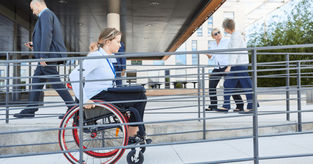 pretty lady in a wheelchair going up a ramp