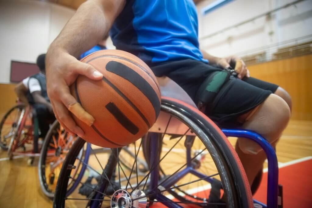 Gentleman playing basketball in a wheelchair