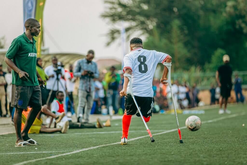 Man Playing soccer and using crutches WOW!!