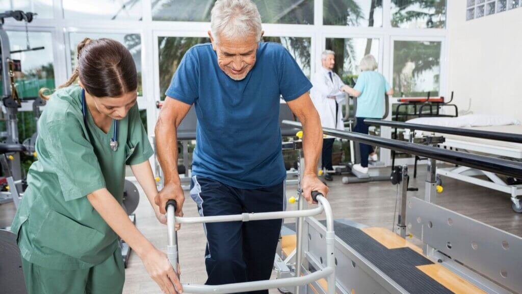 Best Walkers After Hip Surgery: Nurse-helping-patent-with-walker-after-hip-surgery