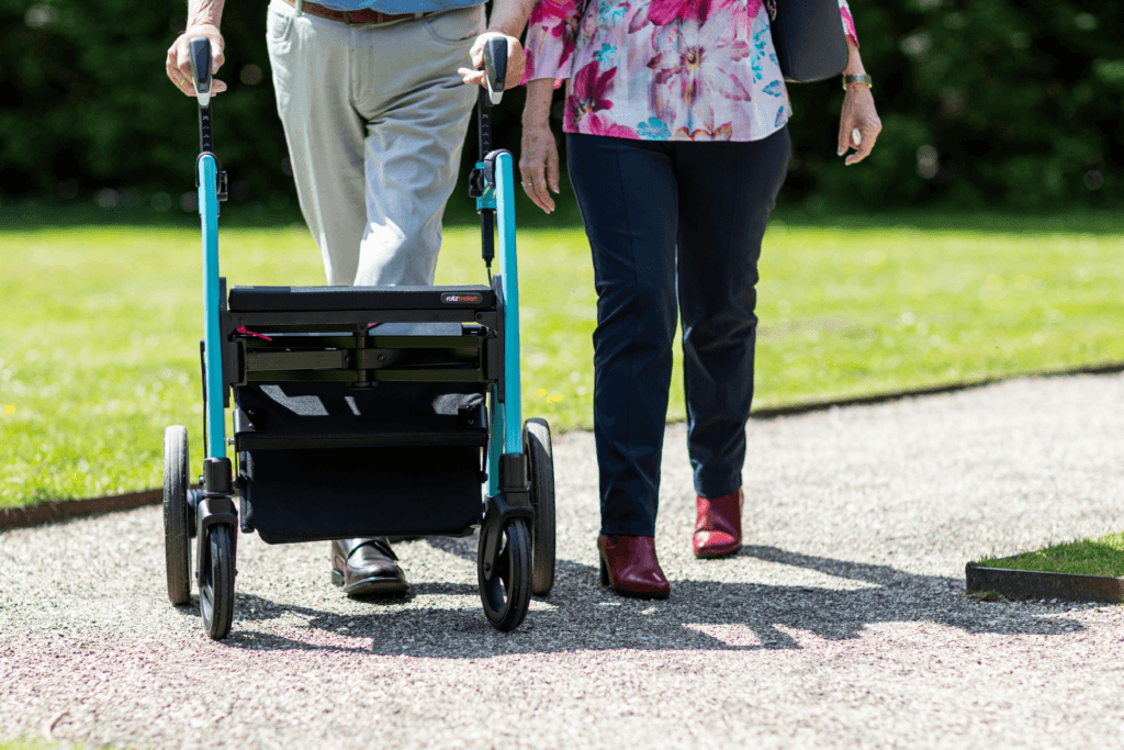 Best Walkers for Seniors: Two People Walking Outdoor with Rollator