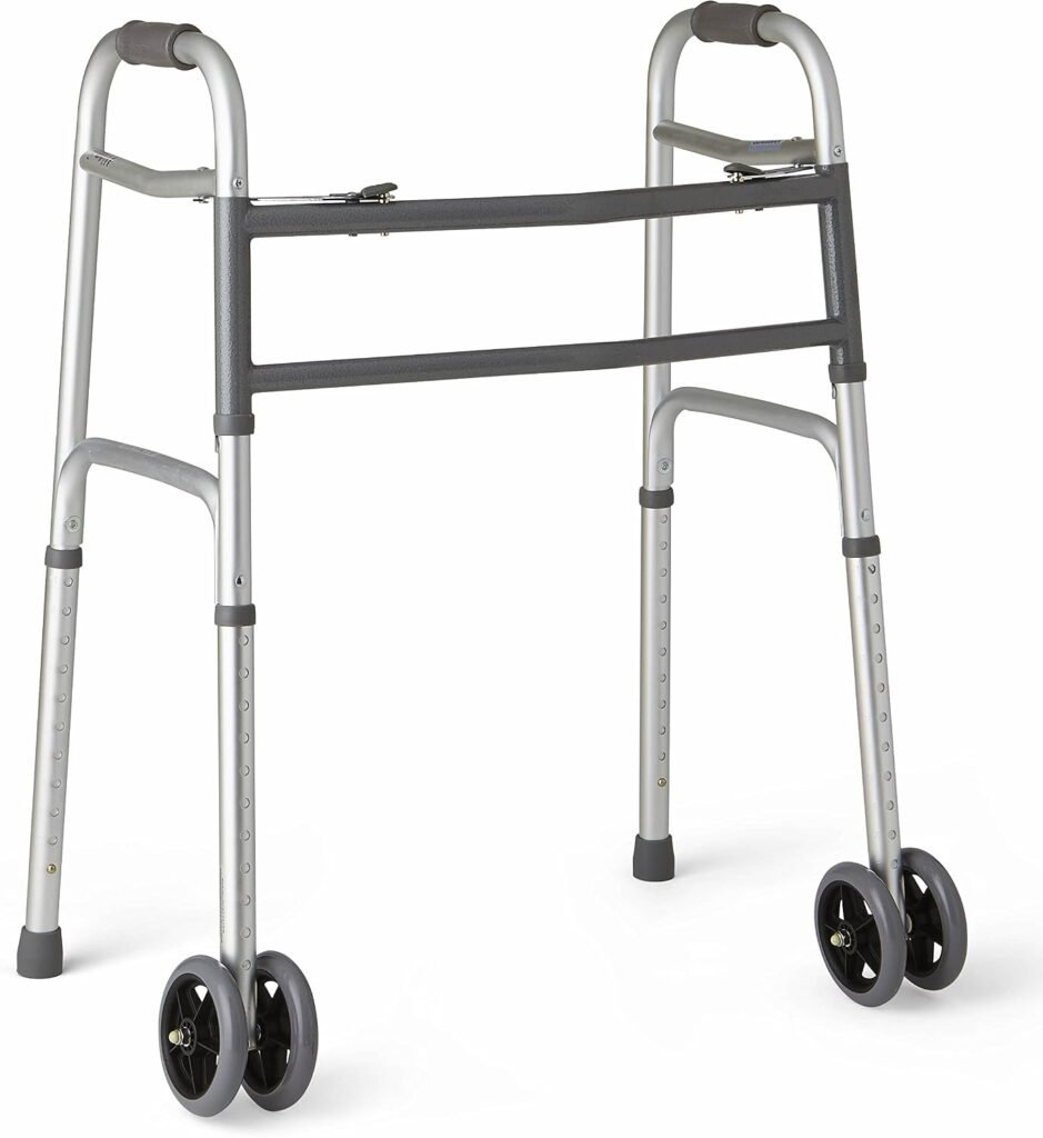 Person using a bariatric walker for support while walking indoors. The heavy-duty mobility aid features a reinforced frame and extra-wide design to provide stability, comfort, and confidence for larger users.