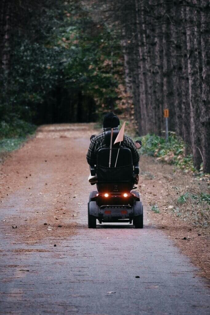 Man o a scooter taking a ride