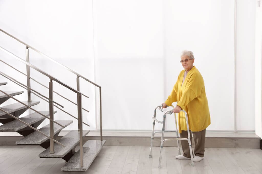 Lady On A Walker and a flight of stairs
