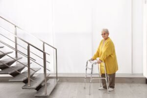 Lady On A Walker and a flight of stairs