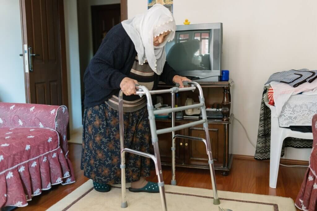 Older woman with on a walker in her house