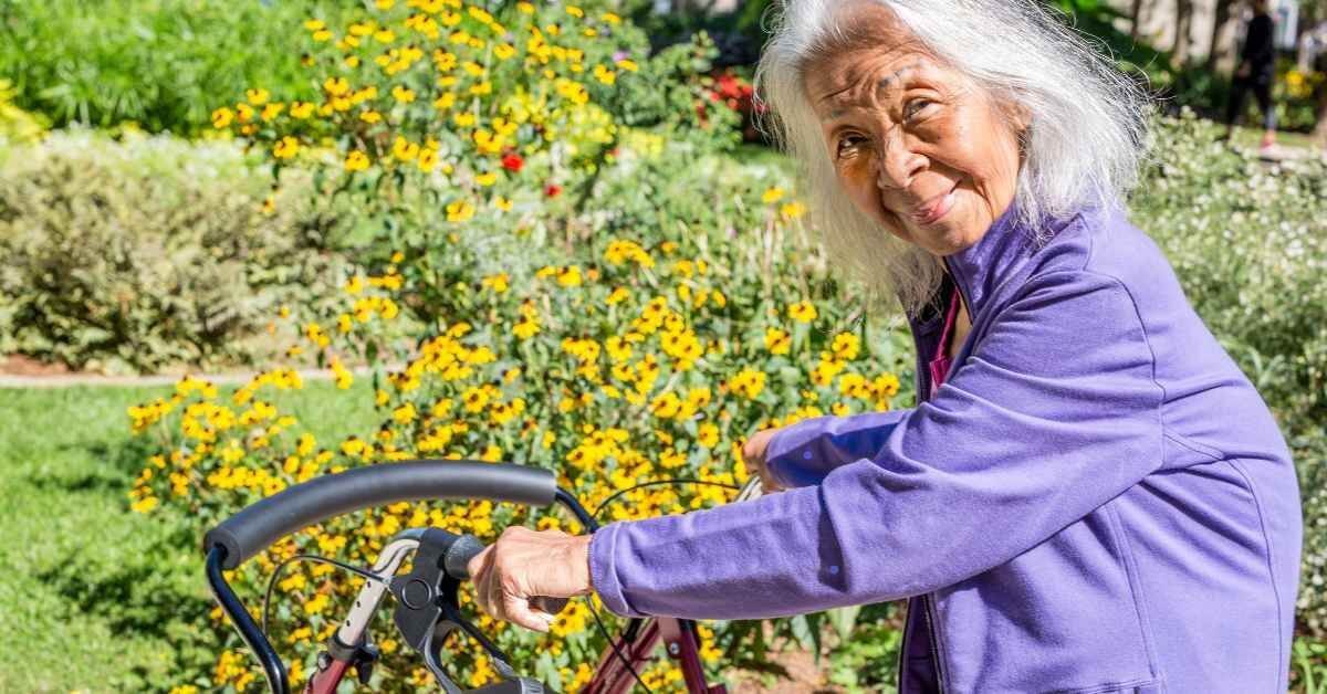 Smiling Lady using a walker
