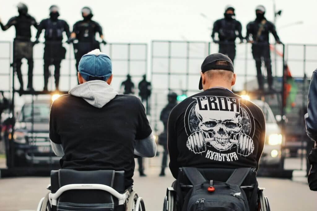 To friends in wheelchairs out at a the racetrack