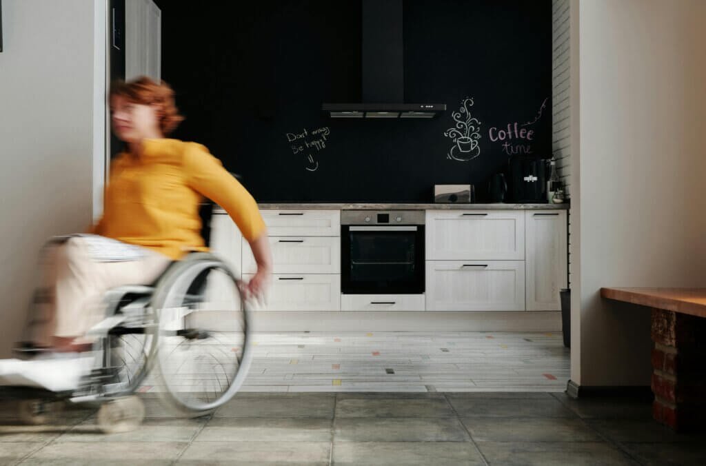Lady in home using a wheelchair for safety