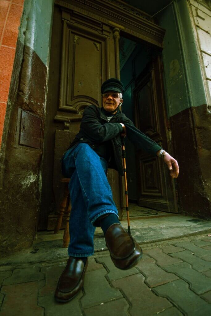 Gentleman relaxing with a cane in his hand