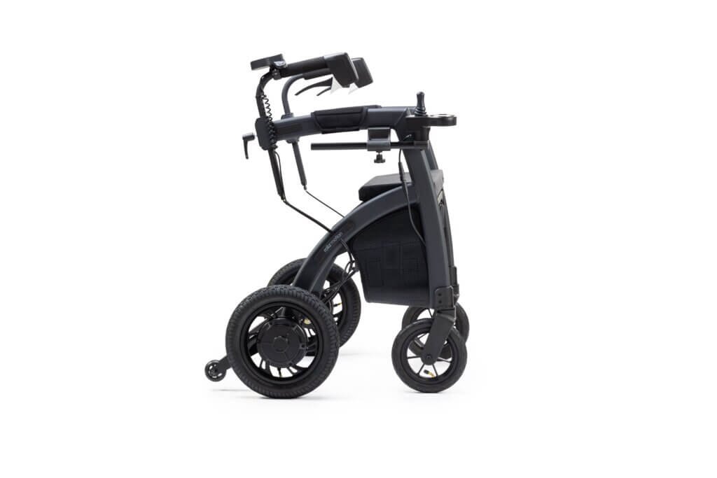 Black upright rollator walker with forearm rests, padded seat, storage bag, and large wheels for improved posture and walking support.