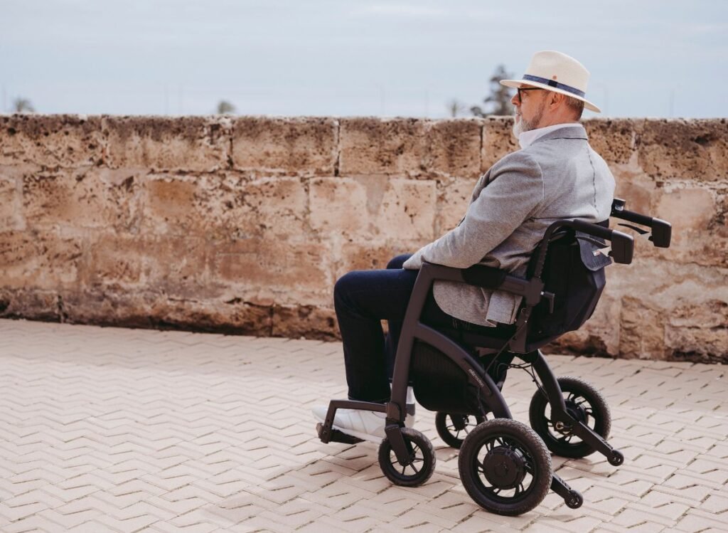 Man using a rollator wheelchair outdoors
